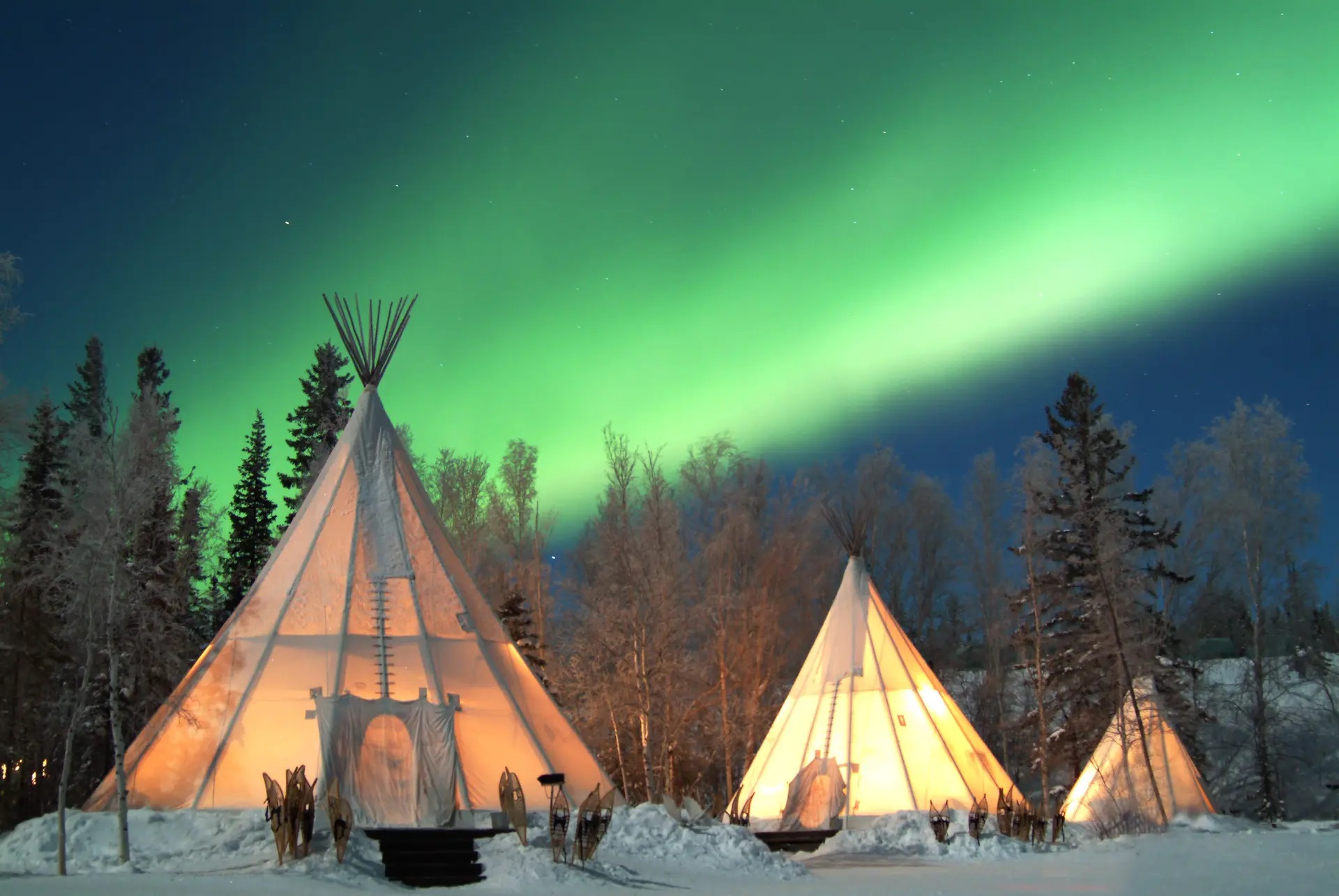 Yellowknife northern lights above heated teepees in the Northwest Territories